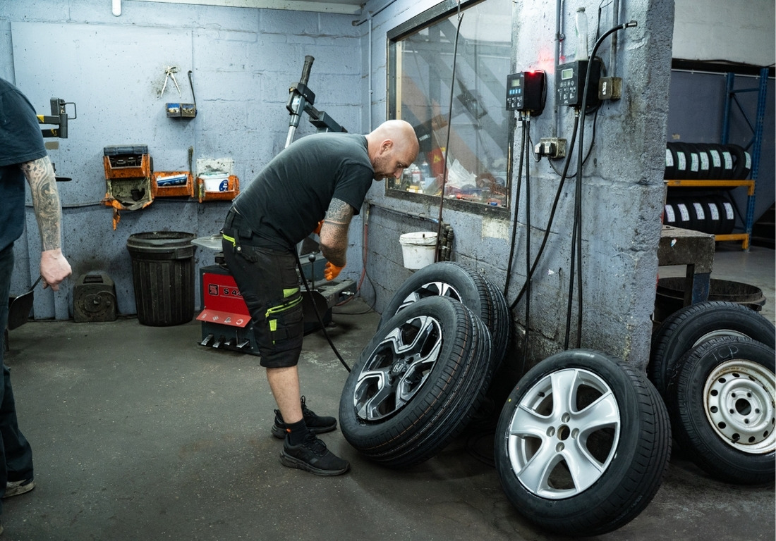Standard image man looking at tyres - M&M Tyres Exeter